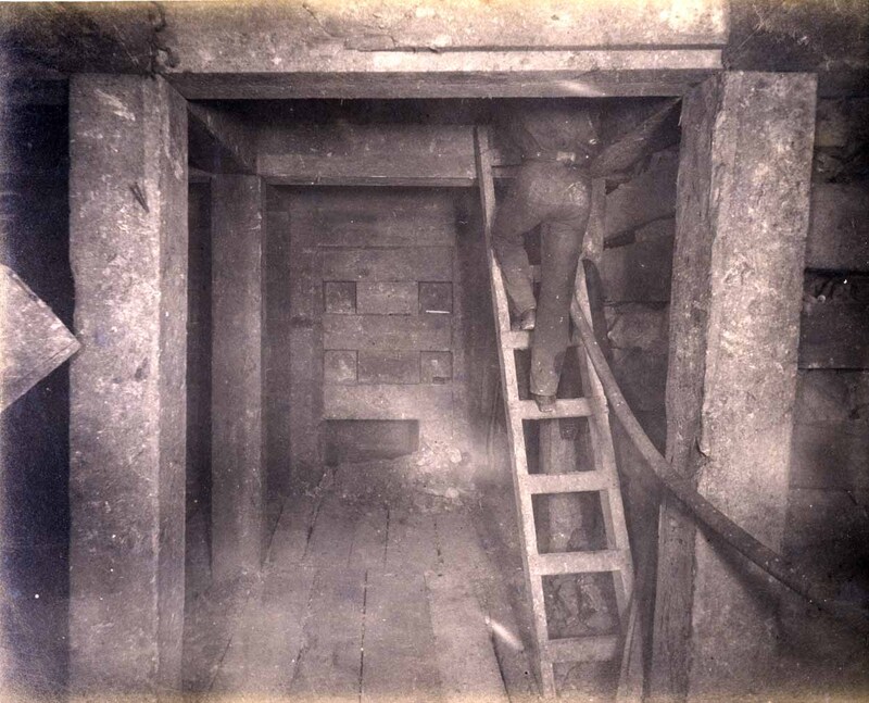 High ore 400 ft. level West Showing bulkheading in 1st floor and miner ascending to 2nd floor with hose for drilling machine