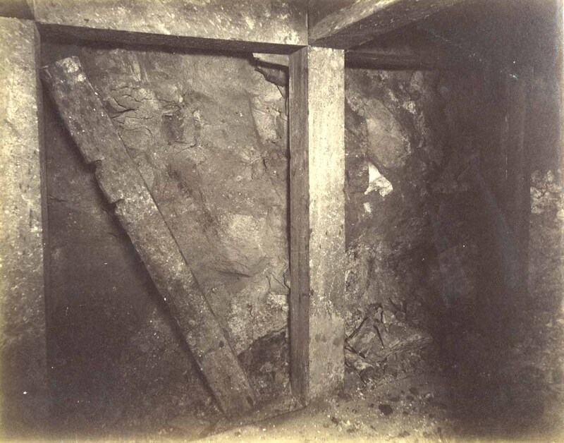 Mt Con 300 level East sill floor.  Showing ore breast closely timbered.