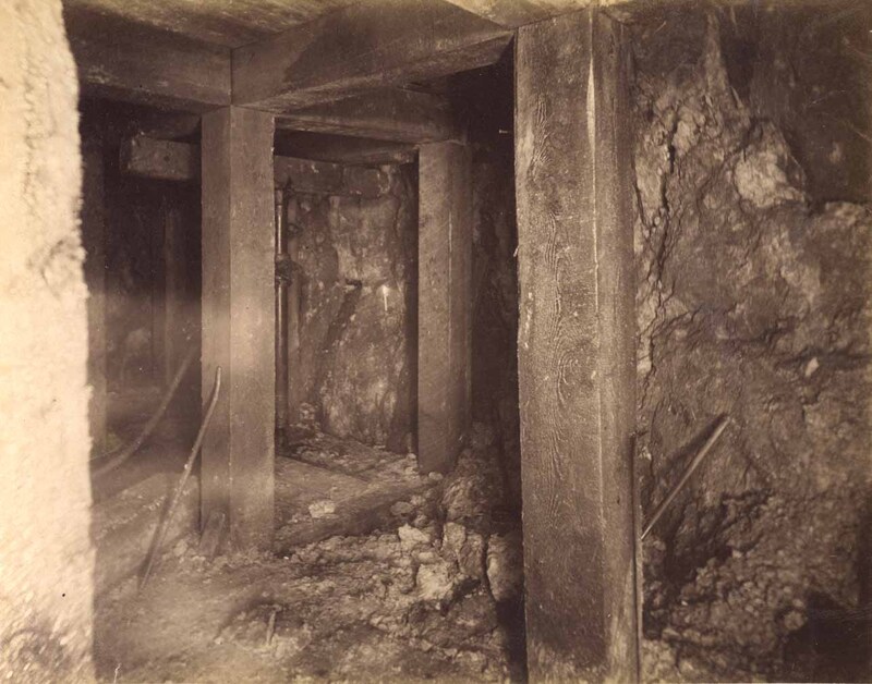 Mt Con 100 level West sill floor.  Showing machine drilling ore breast.