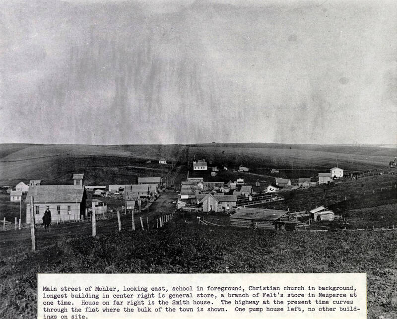 School in foreground, Christian church in background, longest building center right is general store