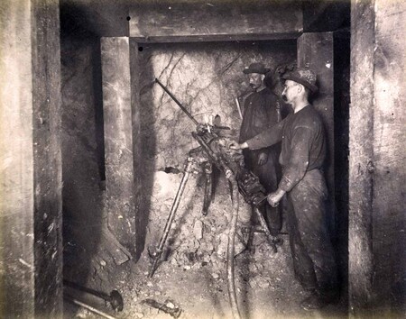 High ore 300 ft. level East Showing tripod and drilling machine in operation