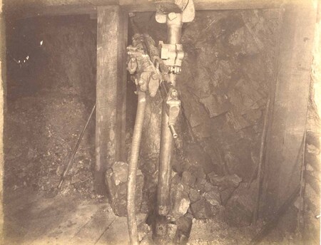 Mountain Consolidated Mine 550 level East sill floor.  Showing drilling machine drilling ore breast . Ore 45 ft.