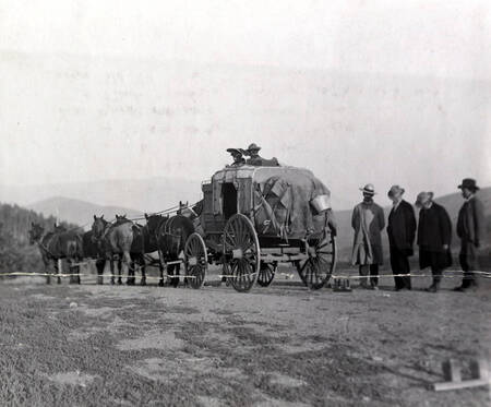 Men looking at ground: Lewis W. Shurtliff and Frank Cannon