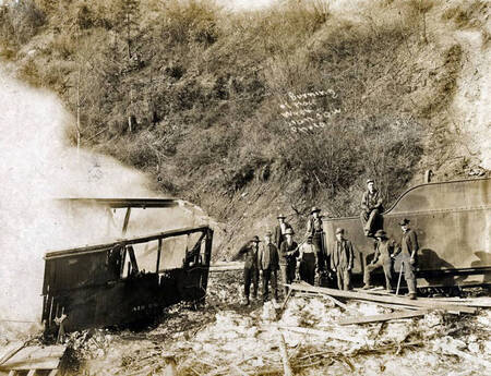 Boxcar burning after train wreck. Mace, Idaho.