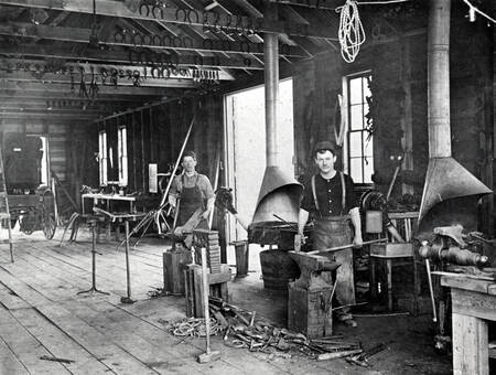 Men working in shop: S.J. Doggett and john Collins?