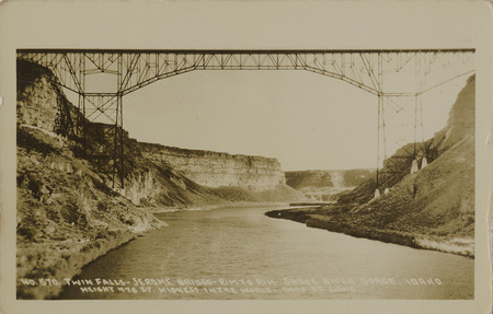 Postcard of the Twin Falls-Jerome Bridge which was replaced in 1976 by the Perrine Memorial Bridge near Twin Falls. | no. 570. Twin Falls - Jerome Bridge - rim to rim - Snake River Gorge, Idaho. Height 476 ft. highest in the world - 1400 ft. long.