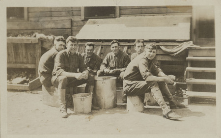 Postcard of men peeling potatoes at Camp Lewis in Washington state.