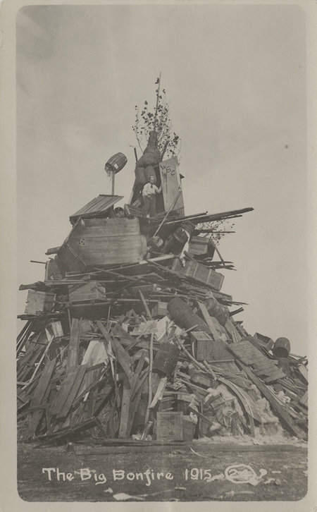 Postcard of a big bonfire before a football game at the University of Idaho.