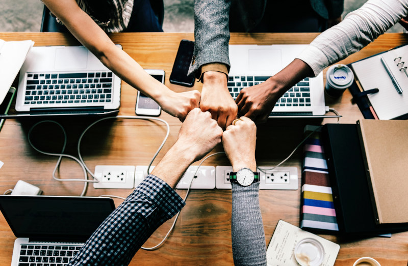 fist bump with computers by rawpixels.com